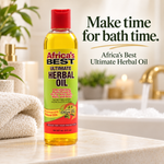 A bottle of Africa's Best Ultimate Herbal Oil stands on a bathroom counter with a towel, plant, soap dispenser, and blurred sink area in the background. Large text on the right reads, 'Make time for bath time.