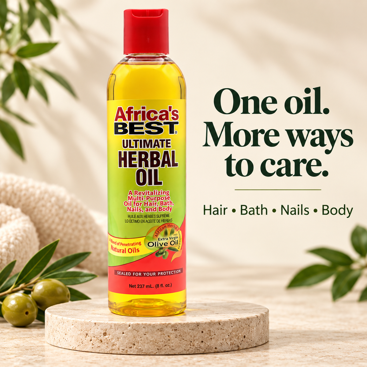 A bottle of Africa's Best Ultimate Herbal Oil stands on a round stone pedestal, surrounded by olive branches and a soft beige towel. The background is a warm, sunlit neutral setting with text on the right reading 'One oil.