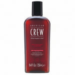 American Crew shampoo bottle on a white background
