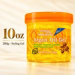 A 10 oz jar of ampro PRO STYL Argan Oil Gel with an orange lid and a yellow-orange label, shown on a warm beige background with text indicating the weight and product type.
