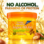 A jar of ampro Pro Styl Argan Oil Gel centered in a promotional graphic with large text reading 'NO ALCOHOL, PARABENS OR PROTEIN.' The product is a translucent yellow gel container with an orange lid and ornate orange label, surrounded by golden liquid splashes, argan nuts, and a white background.