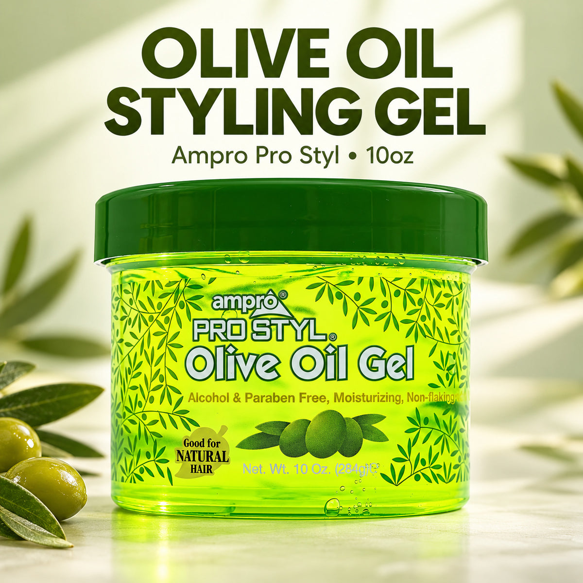 A jar of Ampro Pro Styl Olive Oil Gel styled on a light marble surface with decorative olive branches and olives. The product is a bright green translucent jar with a dark green lid, featuring olive illustrations on the label.