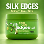 A green jar of Ampere Pro Styling Silk Edges Shine 'n Jam salon size hair product, shown against a matching green gradient background with large white and yellow text reading 'SILK EDGES' above it.