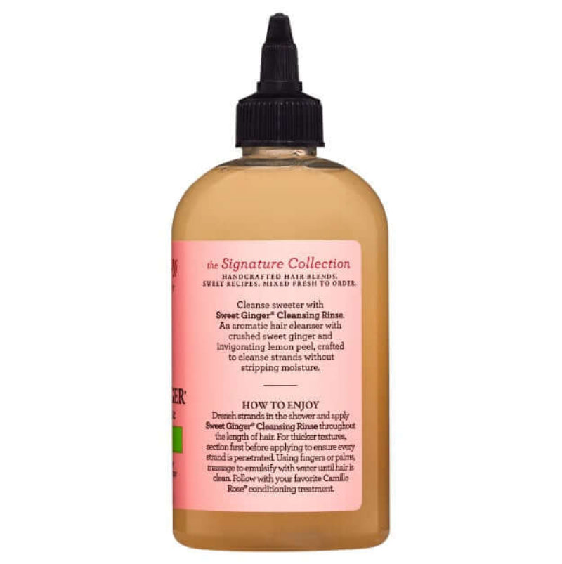 Bottle of hair product with a pink label on a white background