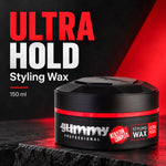 A 150 ml jar of Gummy Professional Ultra Hold Styling Wax, shown on a dark textured surface with a dramatic red and black background. The product packaging is black with a red band and white and red text.