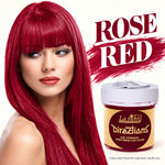A woman with long, straight, vivid rose-red hair is shown beside a jar of La Riche Directions semi-permanent conditioning hair colour. Large text reads 'ROSE RED' over a red paint-stroke background, with small text noting the colour result is shown for inspiration and may vary.