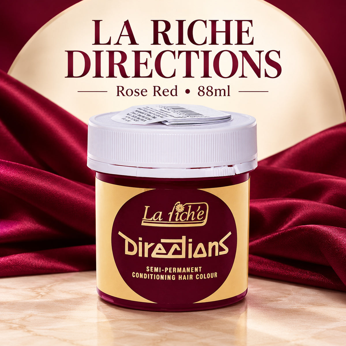 A jar of La Riche Directions Semi-Permanent Conditioning Hair Colour in the shade Rose Red, set against a luxurious dark red satin background with a cream-colored circular backdrop and bold text overlay.