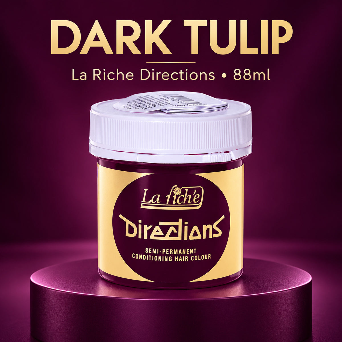 A jar of La Riche Directions 'Dark Tulip' semi-permanent conditioning hair color, displayed on a metallic purple pedestal against a matching purple background. The product packaging features a gold label with a dark purple circle and a white screw cap.