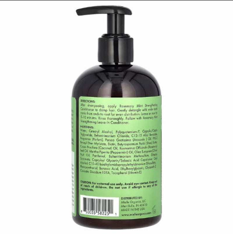 Bottle with green label and black pump on a white background