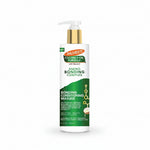 A 12 fl oz white bottle of Palmer's Coconut Oil Formula Amino Bonding Complex Bonding Conditioning Masque with a gold pump and green label, shown on a white background.