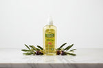 A 150ml bottle of Palmer's Olive Oil Formula Conditioning Spray Oil with Vitamin E, featuring a yellow liquid and a green and yellow label, on a white background.