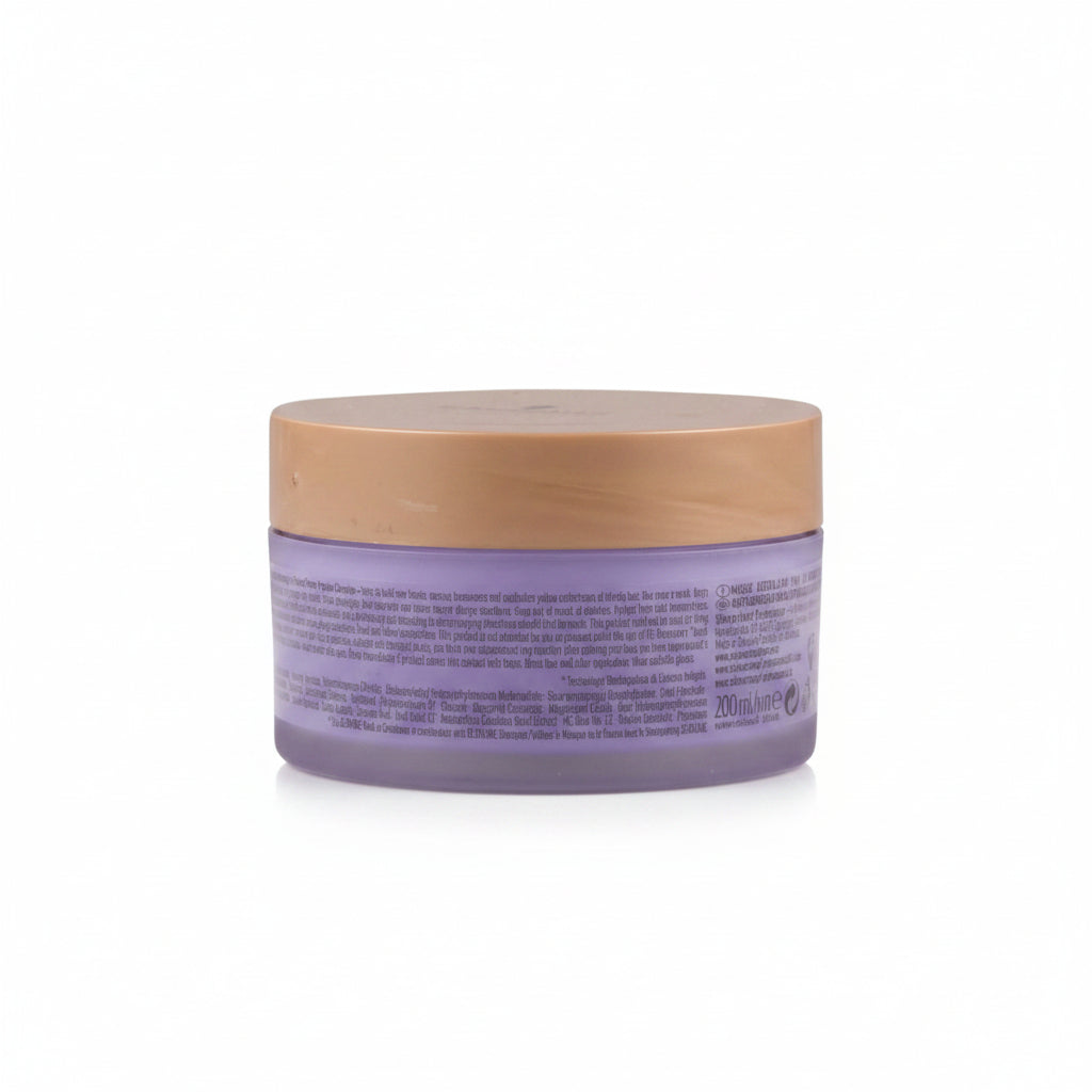 Purple jar with gold lid on a white background