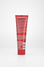 Red tube with text and a barcode on a white background