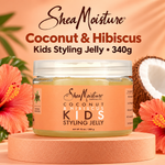 A jar of SheaMoisture Kids Styling Jelly in Coconut & Hibiscus scent, displayed on a pink pedestal with tropical hibiscus flowers and a coconut half in the background. The text at the top reads 'SheaMoisture Coconut & Hibiscus Kids Styling Jelly • 340g'.