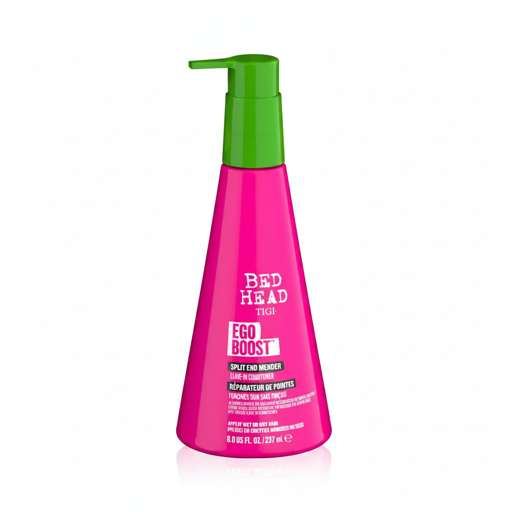 Pink bottle with green pump of Bed Head Ego Boost hair product on a white background