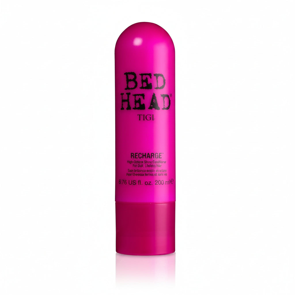 Pink bottle of TIGI Bed Head Recharge hair product on a white background