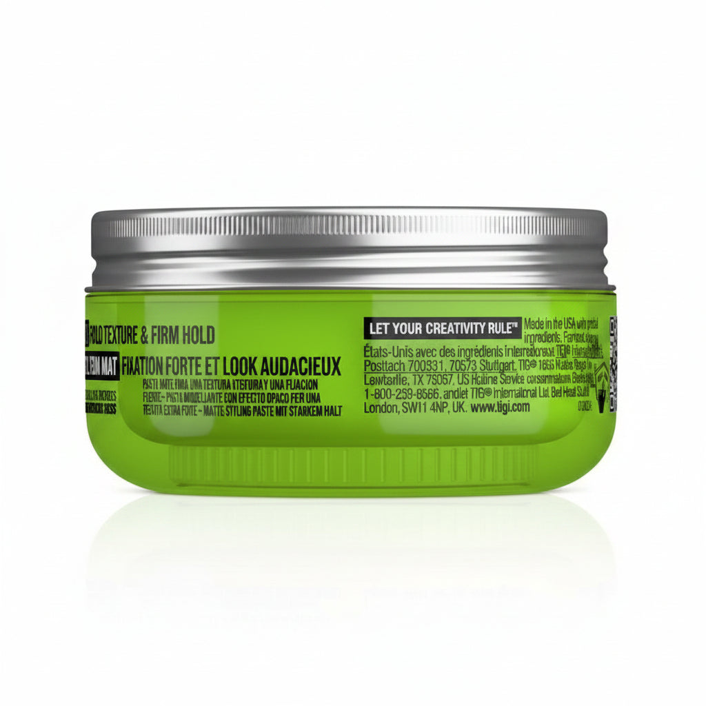 Green hair product jar with silver lid on a white background