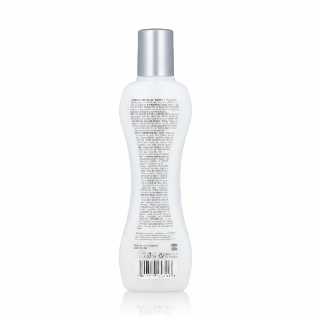 White bottle with silver cap on a white background