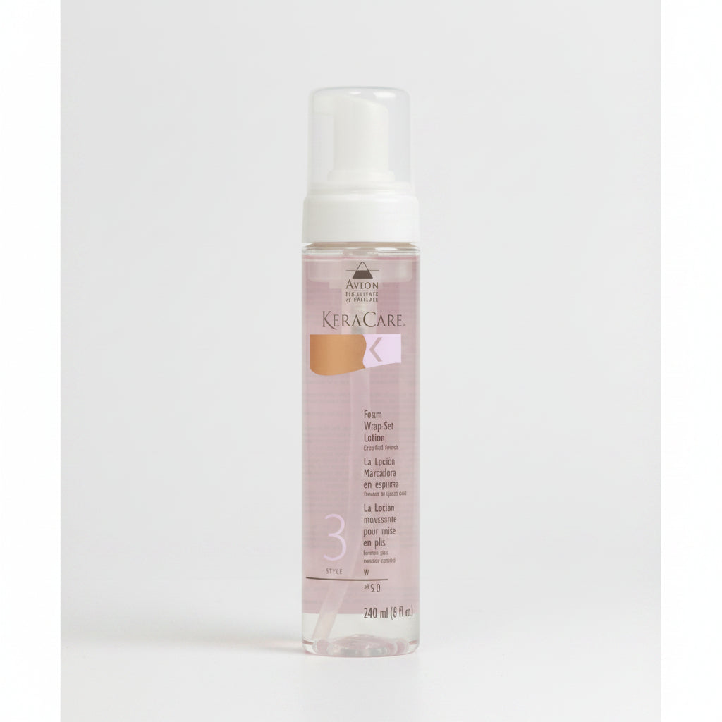 A pump bottle of Keracare Foam Wrap Set Lotion Extra Hold, 240ml, with a pink label.