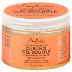 A jar of Shea Moisture Coconut Curling Gel Souffle with the label showing the product name and key ingredients such as Agave Nectar and Flax Seed Oil.