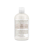 Bottle of coconut milk conditioner on a white background